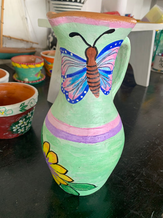 Handpainted terra cotta jug